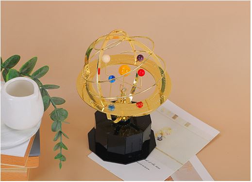 Réplica mecánica de escritorio del sistema solar