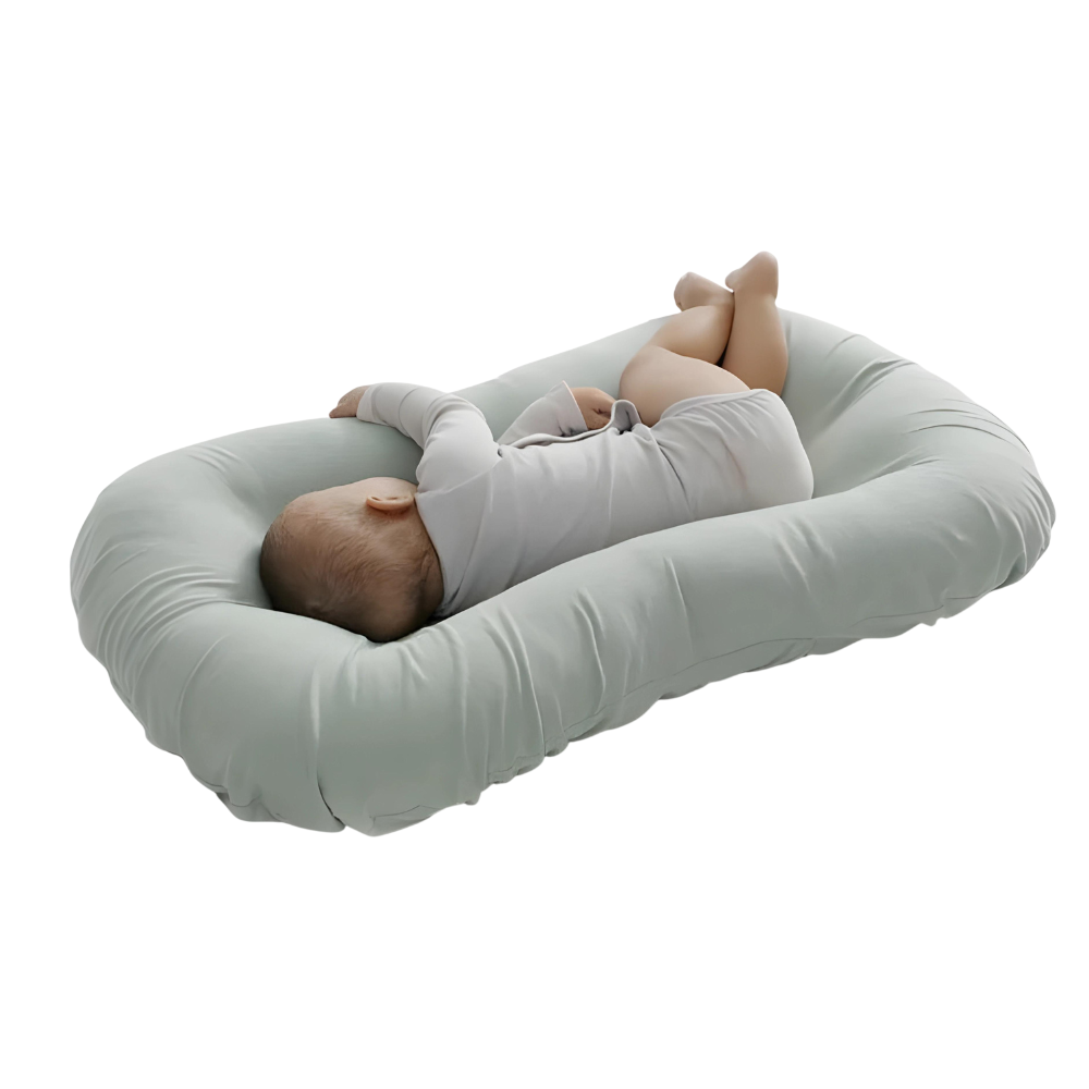 Almohada nido para bebé ovalada con borde acolchado elevado