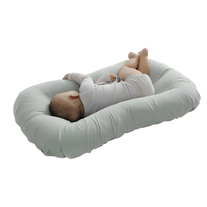 Almohada nido para bebé ovalada con borde acolchado elevado
