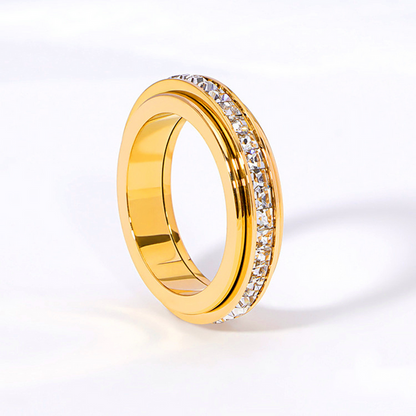 Anillo con banda giratoria de gemas
