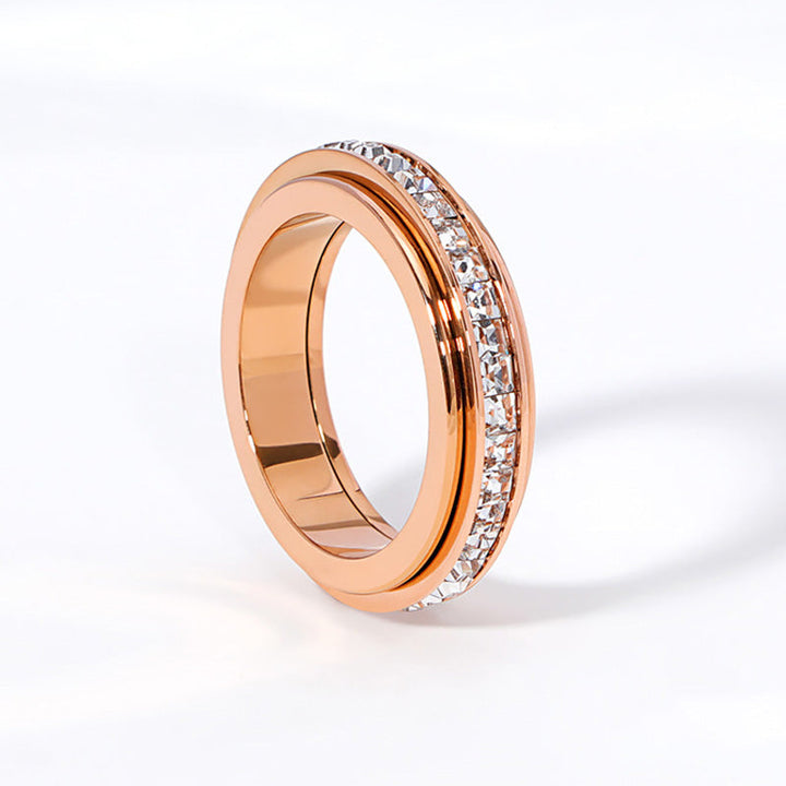 Anillo con banda giratoria de gemas