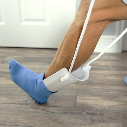Ayuda para colocarse calcetines con cordones de tracción