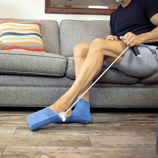 Ayuda para colocarse calcetines con cordones de tracción