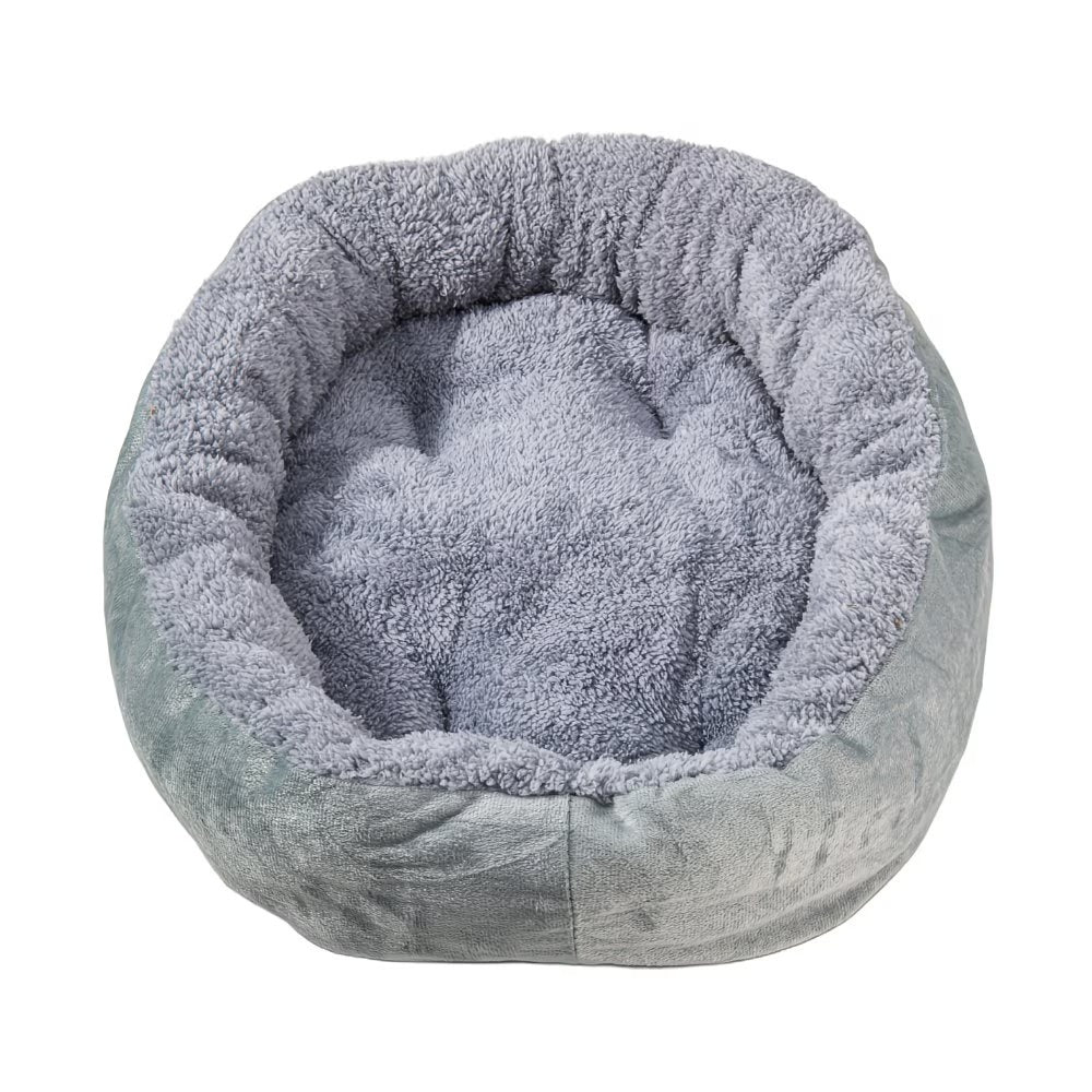 Cama ovalada para mascotas con bordes elevados y revestimiento interior