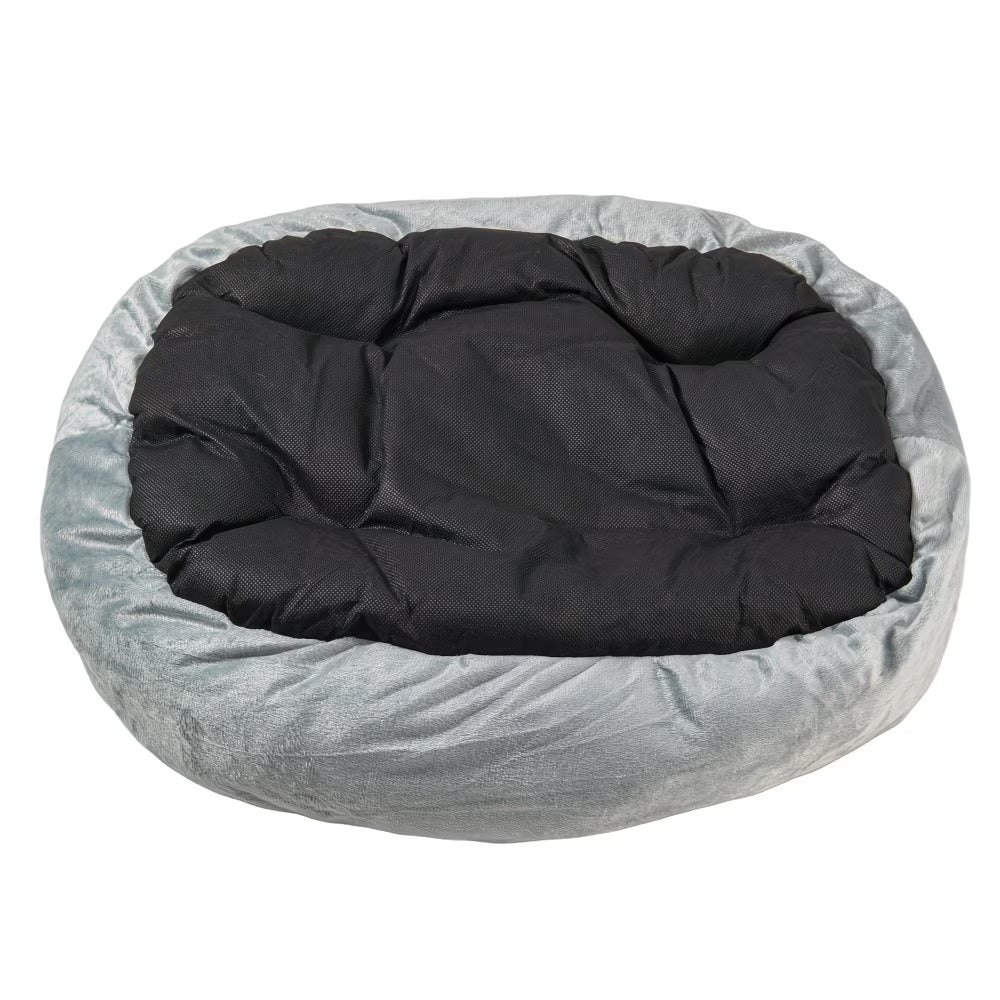Cama ovalada para mascotas con bordes elevados y revestimiento interior