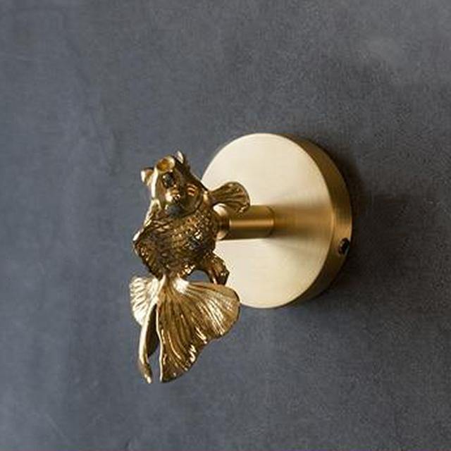 Gancho decorativo de pared con base circular