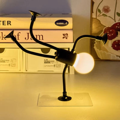 Luz LED con forma de figura y extremidades con ventosas